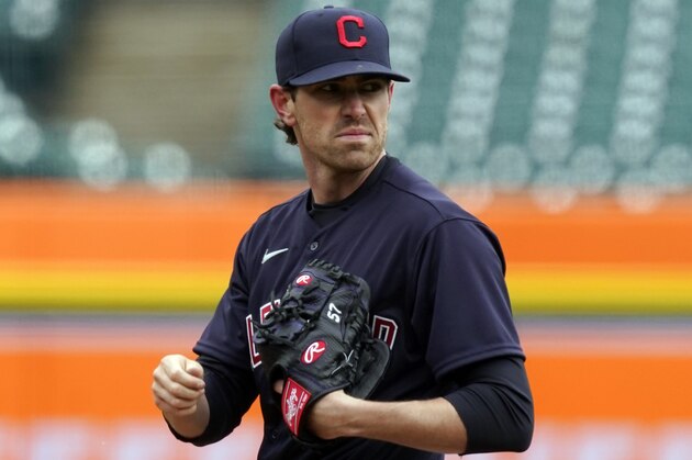 Cleveland Indians starting pitcher Shane Bieber looks towards first during the third inning of a baseball game against the Detroit Tigers, Thursday, April 1, 2021, in Detroit. (AP Photo/Carlos Osorio)