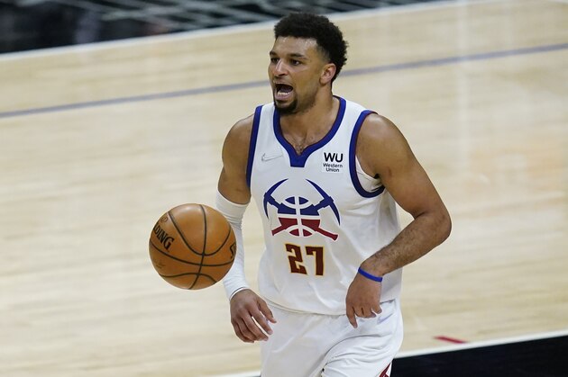Denver Nuggets guard Jamal Murray (27) controls the ball during an NBA basketball game against the Los Angeles Clippers Thursday, April 1, 2021, in Los Angeles. (AP Photo/Ashley Landis)