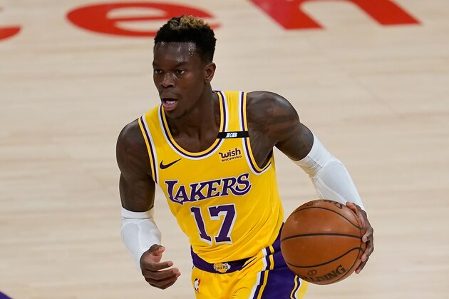 Los Angeles Lakers guard Dennis Schroder (17) controls the ball during an NBA basketball game against the Milwaukee Bucks Wednesday, March 31, 2021, in Los Angeles. (AP Photo/Ashley Landis)