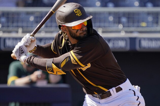 San Diego Padres' Fernando Tatis Jr. bats during a spring training baseball game against the Oakland Athletics, Thursday, March 18, 2021, in Peoria, Ariz. (AP Photo/Sue Ogrocki)