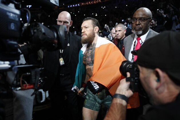 Conor McGregor walks into the ring before fighting Donald