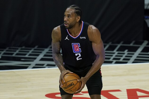 Los Angeles Clippers forward Kawhi Leonard (2) controls the ball during an NBA basketball game against the Denver Nuggets Thursday, April 1, 2021, in Los Angeles. (AP Photo/Ashley Landis)