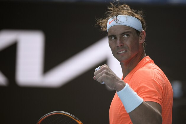Spain's Rafael Nadal celebrates after defeating Italy's Fabio Fognini in their fourth round match at the Australian Open tennis championship in Melbourne, Australia, Monday, Feb. 15, 2021.(AP Photo/Andy Brownbill)