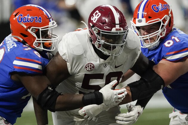 Alabama defensive lineman Christian Barmore (58) works against Florida during the second half of the Southeastern Conference championship NCAA college football game, Saturday, Dec. 19, 2020, in Atlanta. (AP Photo/John Bazemore)