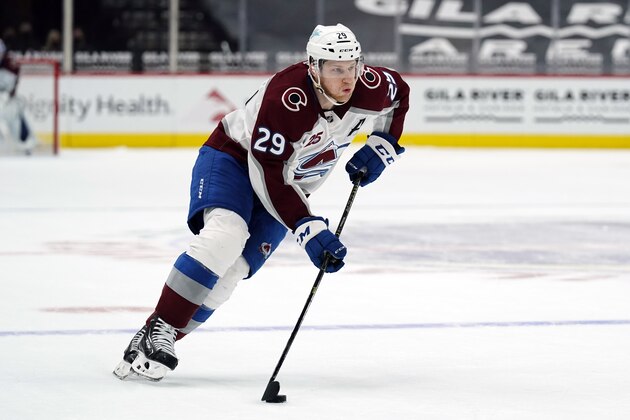 Colorado Avalanche center Nathan MacKinnon (29) in the first period during an NHL hockey game against the Arizona Coyotes, Tuesday, March 23, 2021, in Glendale, Ariz. (AP Photo/Rick Scuteri)