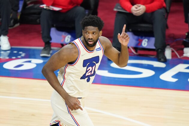 Philadelphia 76ers' Joel Embiid reacts after a basket during the first half of an NBA basketball game against the Los Angeles Clippers, Friday, April 16, 2021, in Philadelphia. (AP Photo/Matt Slocum)