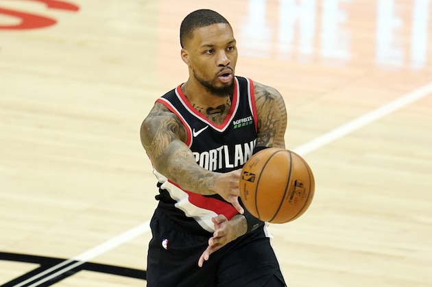 Portland Trail Blazers guard Damian Lillard passes during an NBA basketball game against the Los Angeles Clippers Tuesday, April 6, 2021, in Los Angeles. (AP Photo/Marcio Jose Sanchez)