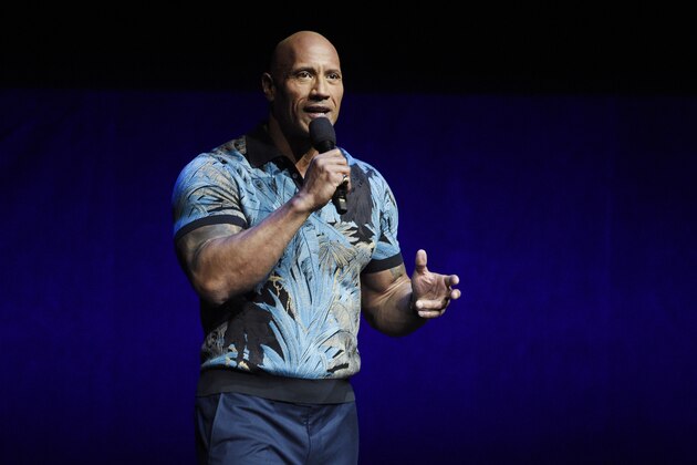 FILE - In this Wednesday, April 3, 2019, file photo, Dwayne Johnson speaks during the Universal Pictures presentation at CinemaCon 2019, the official convention of the National Association of Theatre Owners (NATO) at Caesars Palace, in Las Vegas. Johnson says he and his family tested positive for the coronavirus. Johnson announced their diagnosis in an 11-plus minute video on Instagram on Wednesday, Sept. 2, 2020. (Photo by Chris Pizzello/Invision/AP, File)