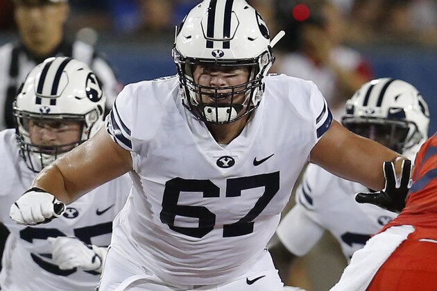 FILE - Brigham Young offensive lineman Brady Christensen (67) is shown in action in the first half during an NCAA college football game against Arizona in Tucson, Ariz., in this Saturday, Sept. 1, 2018, file photo. Christensen was selected to The Associated Press All-America first-team offense, Monday, Dec. 28, 2020. (AP Photo/Rick Scuteri)
