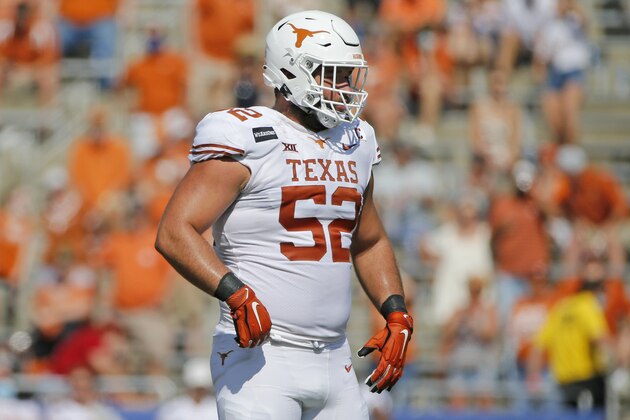 Texas offensive lineman Samuel Cosmi (52) prepares to block against Oklahoma during the second half of an NCAA college football game in Dallas,Tx, Saturday, Oct. 10, 2020. (AP Photo/Michael Ainsworth)