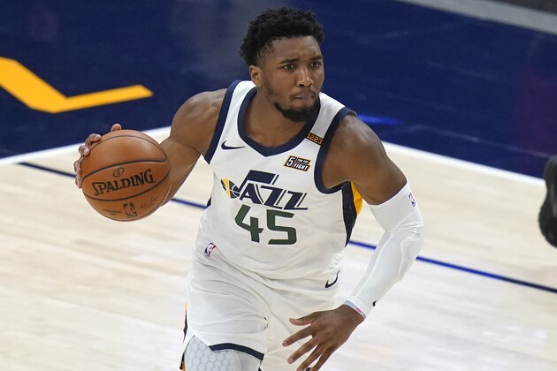 Utah Jazz guard Donovan Mitchell (45) brings the ball up diromg the first half of the team's NBA basketball game against the Indiana Pacers on Friday, April 16, 2021, in Salt Lake City. (AP Photo/Rick Bowmer)