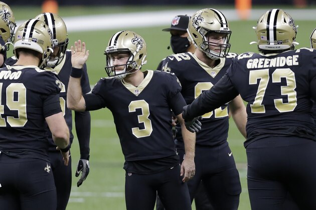 New Orleans Saints kicker Wil Lutz (3) celebrates with teammates after kicking a field goal against the Tampa Bay Buccaneers during the first half of an NFL divisional round playoff football game, Sunday, Jan. 17, 2021, in New Orleans. (AP Photo/Brett Duke)