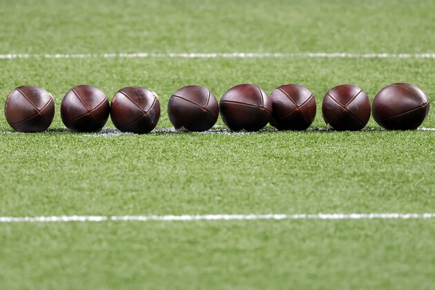 Footballs are seen on the field before an NFL wild-card playoff football game between the New Orleans Saints and the Chicago Bears, Sunday, Jan. 10, 2021, in New Orleans. The Saints defeated the Bears 21-9. (AP Photo/Tyler Kaufman)