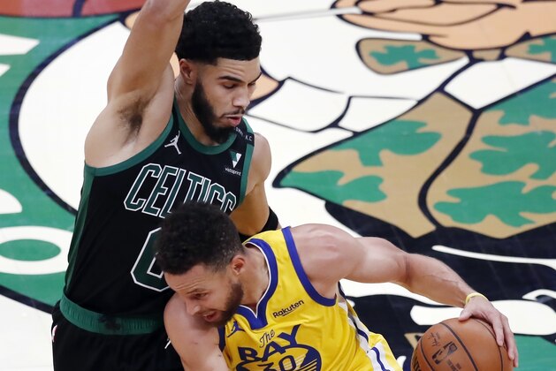Golden State Warriors' Stephen Curry (30) drives past Boston Celtics' Jayson Tatum (0) during the second half of an NBA basketball game, Saturday, April 17, 2021, in Boston. (AP Photo/Michael Dwyer)