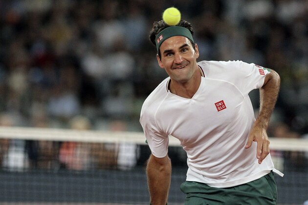 Roger Federer in action during the exhibition tennis match against Rafael Nadal held at the Cape Town Stadium in Cape Town, South Africa, Friday Feb. 7, 2020. (AP Photo/Halden Krog)