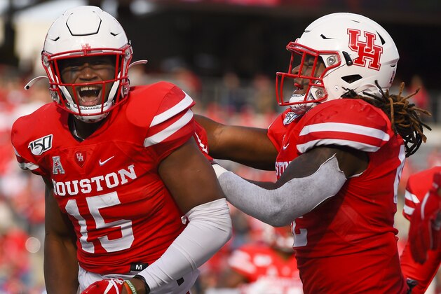 Houston linebacker Zamar Kirven (15) celebrates his interception with linebacker Terrance Edgeston during the first half of an NCAA college football game against Memphis, Saturday, Nov. 16, 2019, in Houston. (AP Photo/Eric Christian Smith)