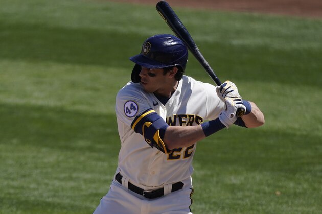 Milwaukee Brewers' Christian Yelich (22) bats during a spring training baseball game against the Colorado Rockies Wednesday, March 24, 2021, in Phoenix. (AP Photo/Ashley Landis)