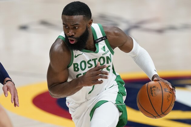Boston Celtics guard Jaylen Brown (7) in the first half of an NBA basketball game Sunday, April 11, 2021, in Denver. (AP Photo/David Zalubowski)