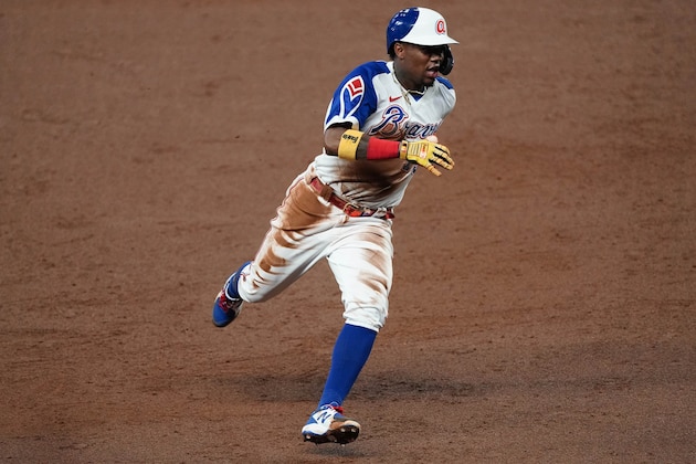 Atlanta Braves right fielder Ronald Acuna Jr. (13) runs the base during a baseball game against the Miami Marlins Tuesday, April 13, 2021, in Atlanta. (AP Photo/John Bazemore)