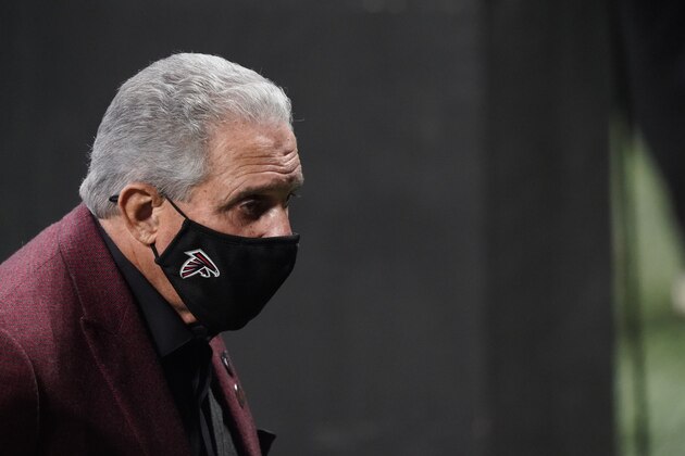 Atlanta Falcons Owner Arthur Blank walks on the turf before the first half of an NFL football game between the Atlanta Falcons and the Tampa Bay Buccaneers, Sunday, Dec. 20, 2020, in Atlanta. (AP Photo/Brynn Anderson)