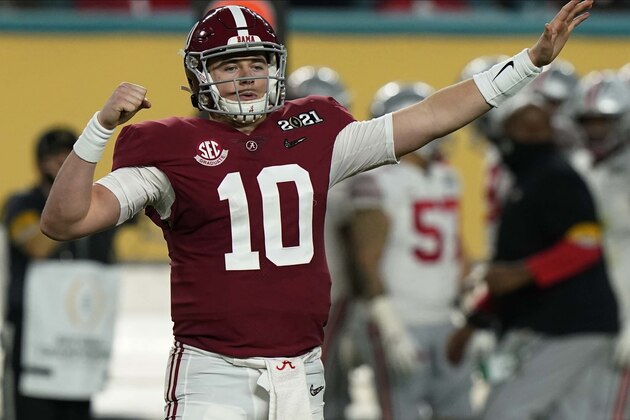 Alabama quarterback Mac Jones celebrates after a touchdown by wide receiver DeVonta Smith during the first half of an NCAA College Football Playoff national championship game against Ohio State, Monday, Jan. 11, 2021, in Miami Gardens, Fla. (AP Photo/Lynne Sladky)