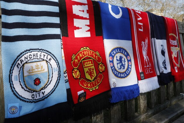 A selection of scarves of the English soccer Premier League teams who are reported to be part of a proposed European Super League, laid out and photographed, in London, Monday, April 19, 2021.  The 12 European clubs planning to start a breakaway Super League have told the leaders of FIFA and UEFA that they have begun legal action aimed at fending off threats to block the competition. (AP Photo/Alastair Grant)