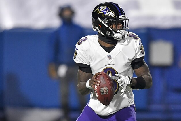 Baltimore Ravens quarterback Lamar Jackson (8) looks to pass against the Buffalo Bills during the first half of an NFL divisional round football game Saturday, Jan. 16, 2021, in Orchard Park, N.Y. (AP Photo/Adrian Kraus)
