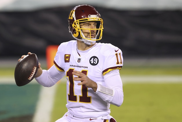 FILE - Washington Football Team quarterback Alex Smith (11) is shown in action against the Philadelphia Eagles during an NFL football game in Philadelphia, in this Sunday, Jan. 3, 2021, file photo. Smith announced his retirement Monday, April 19, 2021, on Instagram, saying he still has plenty of snaps left him just shy of his 37th birthday but is calling it quits to enjoy time with his family. (AP Photo/Rich Schultz, FIle)