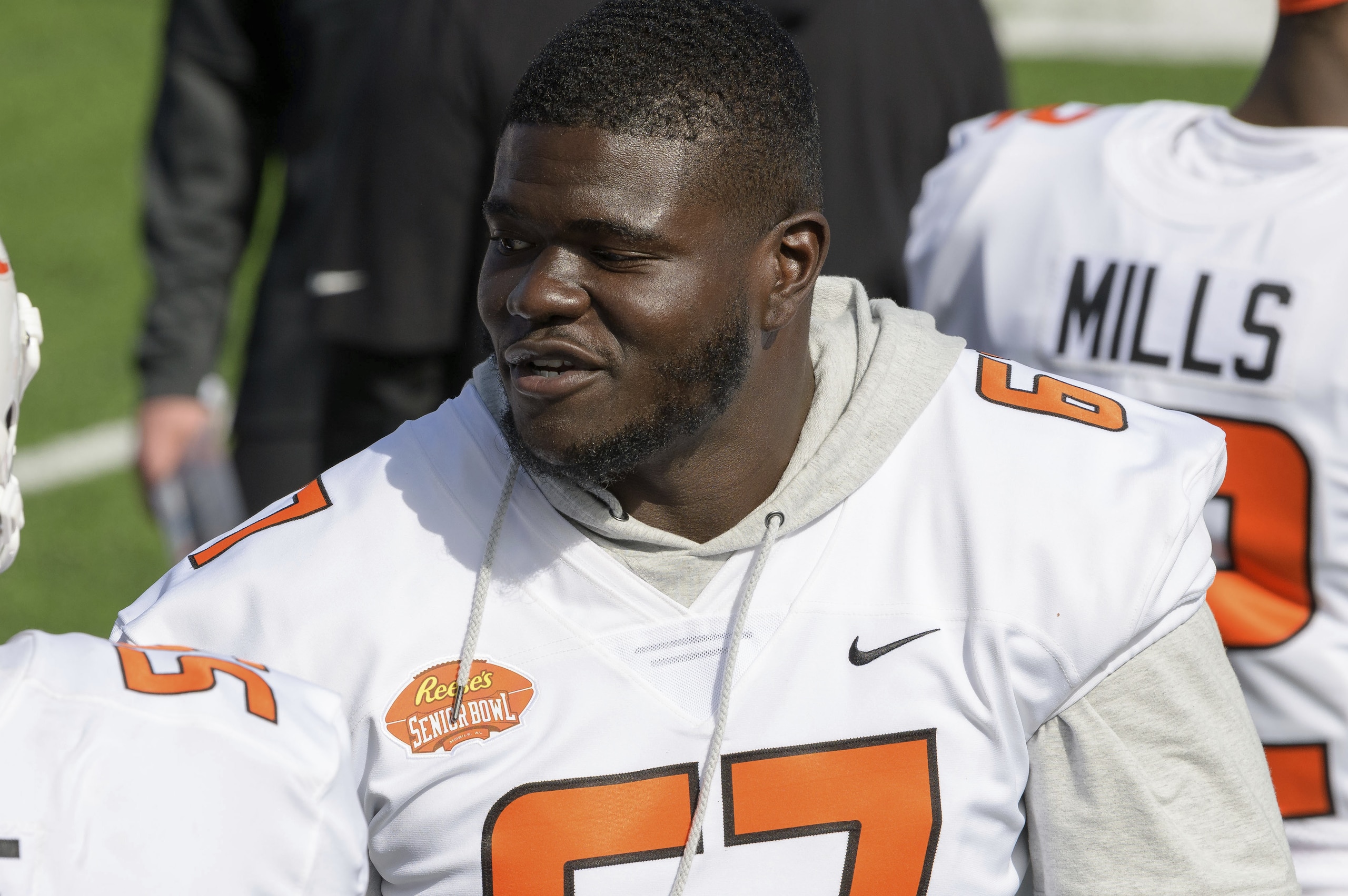 American Team offensive lineman D'Ante Smith of East Carolina (67) walks the sidelines during the NCAA Senior Bowl college football game in Mobile, Ala., Saturday, Jan. 30, 2021. (AP Photo/Matthew Hinton)