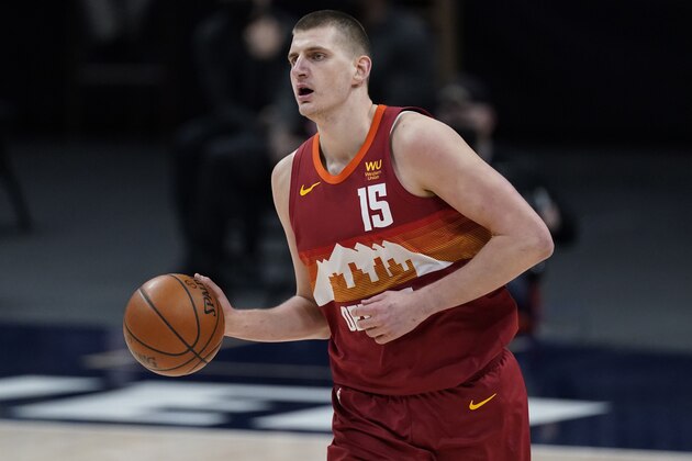 Denver Nuggets center Nikola Jokic (15) in the first half of an NBA basketball game Wednesday, April 14, 2021, in Denver. (AP Photo/David Zalubowski)