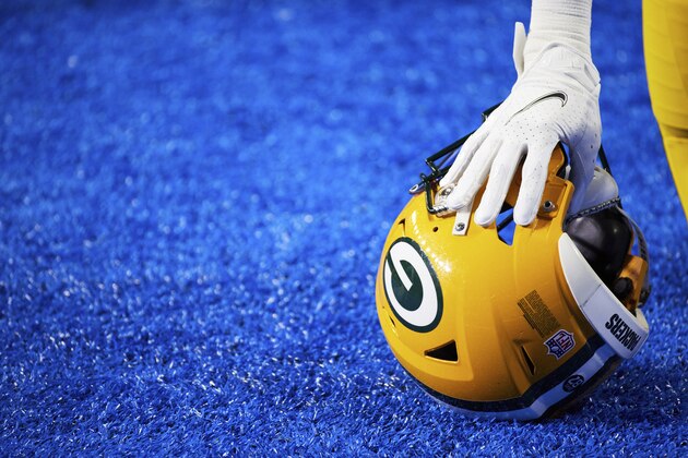 Green Bay Packers cornerback Kevin King (20) rests his hand on his helmet as he takes a knee against the Detroit Lions during an NFL football game, Sunday, Dec. 13, 2020, in Detroit. (AP Photo/Rick Osentoski)