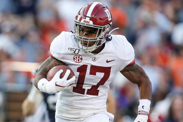 Alabama wide receiver Jaylen Waddle (17) carries the ball against Auburn during an NCAA college football game Saturday, Nov. 30, 2019, in Auburn, Ala. (AP Photo/Butch Dill)