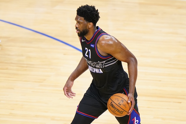 Philadelphia 76ers' Joel Embiid dribbles during the first half of an NBA basketball game against the Golden State Warriors, Monday, April 19, 2021, in Philadelphia. (AP Photo/Matt Slocum)