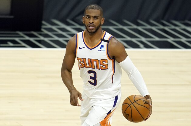 Phoenix Suns guard Chris Paul dribbles during the first half of an NBA basketball game against the Los Angeles Clippers Thursday, April 8, 2021, in Los Angeles. (AP Photo/Marcio Jose Sanchez)