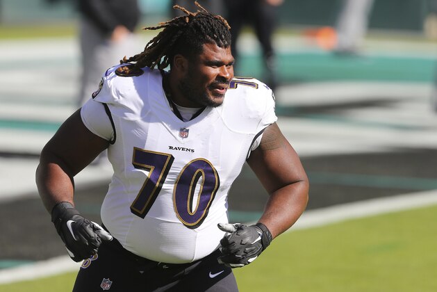 Baltimore Ravens' D.J. Fluker (70) warms up before an NFL football game against the Philadelphia Eagles, Sunday, Oct. 18, 2020, in Philadelphia. The Ravens defeated the Eagles 30-28. (AP Photo/Rich Schultz)