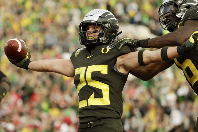 Oregon safety Brady Breeze celebrates after scoring on a blocked punt during second half of the Rose Bowl NCAA college football game against Wisconsin Wednesday, Jan. 1, 2020, in Pasadena, Calif. (AP Photo/Marcio Jose Sanchez)