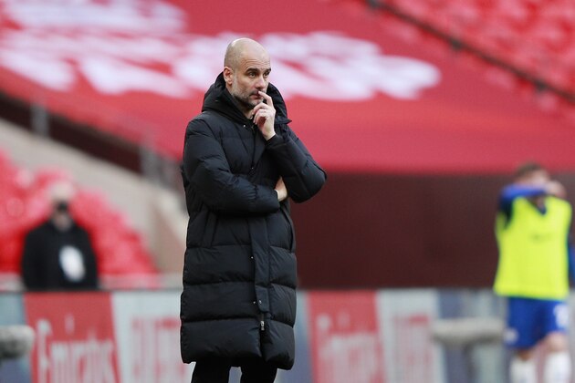 Manchester City's head coach Pep Guardiola stands during the English FA Cup semifinal soccer match between Chelsea and Manchester City at Wembley Stadium in London, England, Saturday, April 17, 2021. (AP Photo/Ian Walton, Pool)