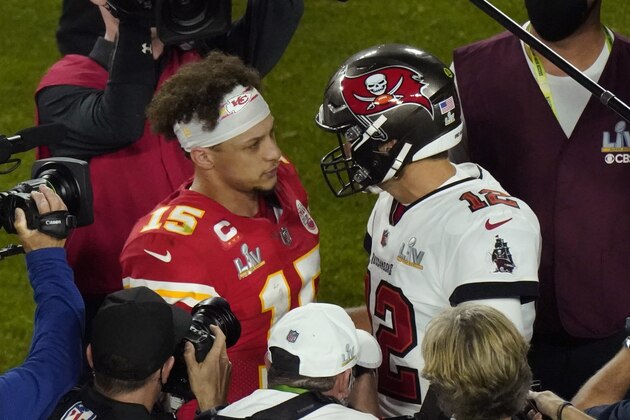 Kansas City Chiefs quarterback Patrick Mahomes (15) and Tampa Bay Buccaneers quarterback Tom Brady (12) greet following the NFL Super Bowl 55 football game Sunday, Feb. 7, 2021, in Tampa, Fla. Tampa Bay won 31-9. (AP Photo/Charlie Riedel)