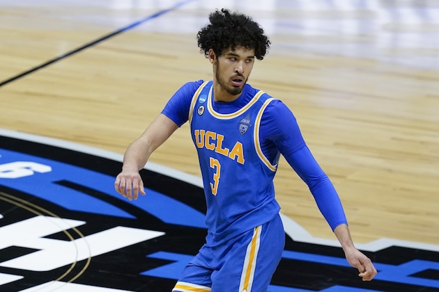 UCLA guard Johnny Juzang runs up court after making a basket during the second half of an Elite 8 game against Michigan in the NCAA men's college basketball tournament at Lucas Oil Stadium, Tuesday, March 30, 2021, in Indianapolis. (AP Photo/Darron Cummings)