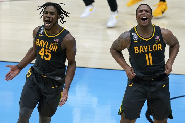 Baylor guard Davion Mitchell (45) and Baylor guard Mark Vital (11) celebrate at the end of the championship game against Gonzaga in the men's Final Four NCAA college basketball tournament, Monday, April 5, 2021, at Lucas Oil Stadium in Indianapolis. Baylor won 86-70. (AP Photo/Darron Cummings)