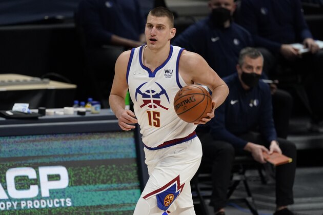 Denver Nuggets center Nikola Jokic (15) in the first half of an NBA basketball game Saturday, March 13, 2021, in Denver. (AP Photo/David Zalubowski)