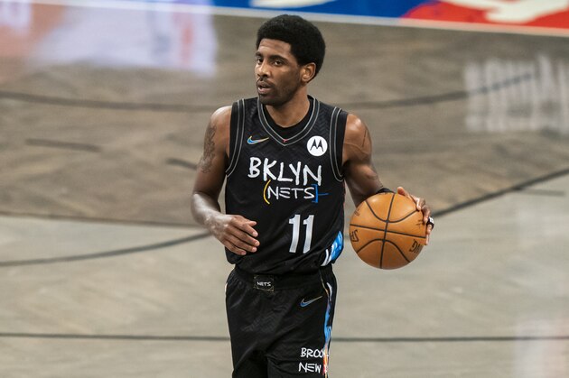 Brooklyn Nets guard Kyrie Irving (11) dribbles down court in the first half of an NBA basketball game, Saturday, April 10, 2021, in New York. (AP Photo/Corey Sipkin)