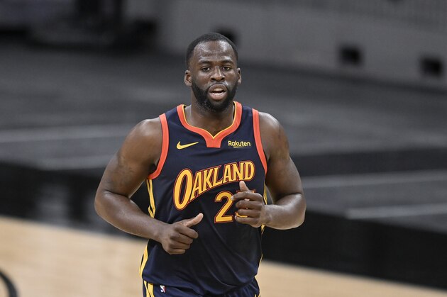 Golden State Warriors' Draymond Green runs up the court during the second half of an NBA basketball game against the San Antonio Spurs, Monday, Feb. 8, 2021, in San Antonio. (AP Photo/Darren Abate)