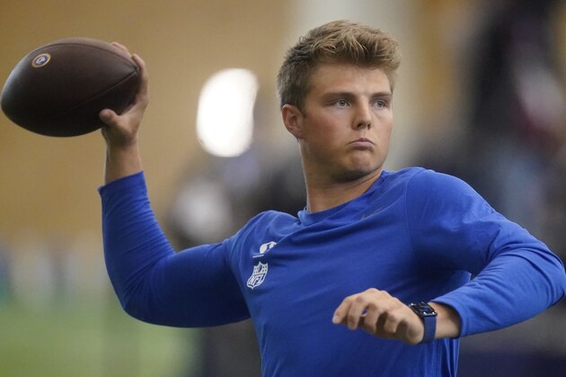 BYU quarterback Zach Wilson warms up before participating in the school's pro day  football workout for NFL scouts Friday, March 26, 2021, in Provo, Utah. (AP Photo/Rick Bowmer)