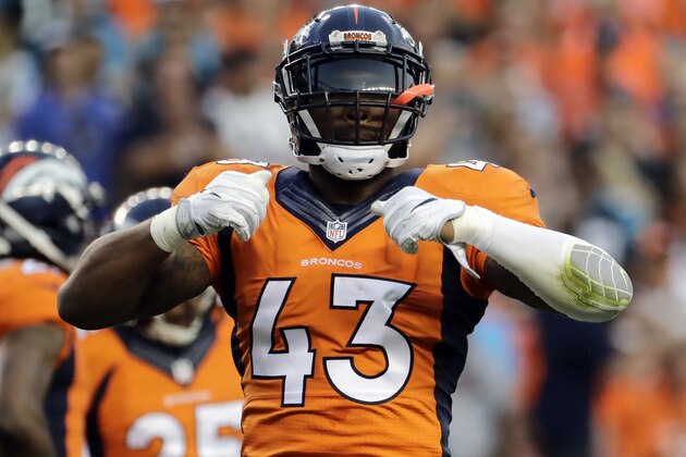 Denver Broncos strong safety T.J. Ward celebrates against the Carolina Panthers during the first half of an NFL football game, Thursday, Sept. 8, 2016, in Denver. (AP Photo/Jack Dempsey)
