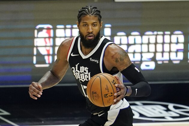 Los Angeles Clippers guard Paul George dribbles during an NBA basketball game against the Los Angeles Lakers Sunday, April 4, 2021, in Los Angeles. (AP Photo/Marcio Jose Sanchez)