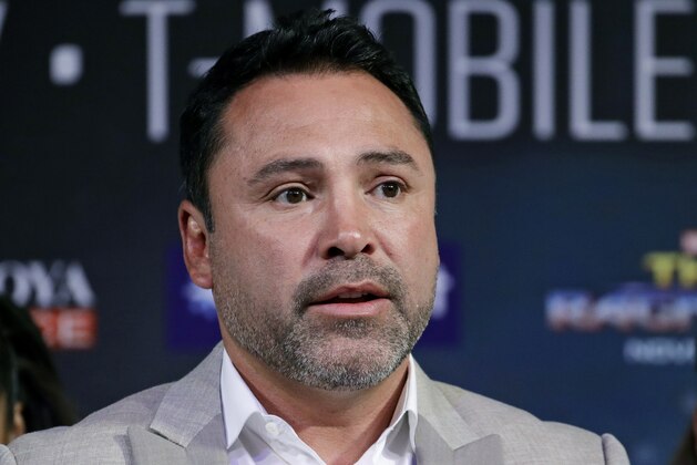 FILE - In this Sept. 13, 2017 file photo, Oscar de la Hoya speaks during a news conference in Las Vegas. De La Hoya denies accusations of sexual assault contained in a lawsuit filed against him this week. The boxing promoter's company, Golden Boy Promotions, issued a statement Tuesday, Oct. 22, 2019, describing the action as a