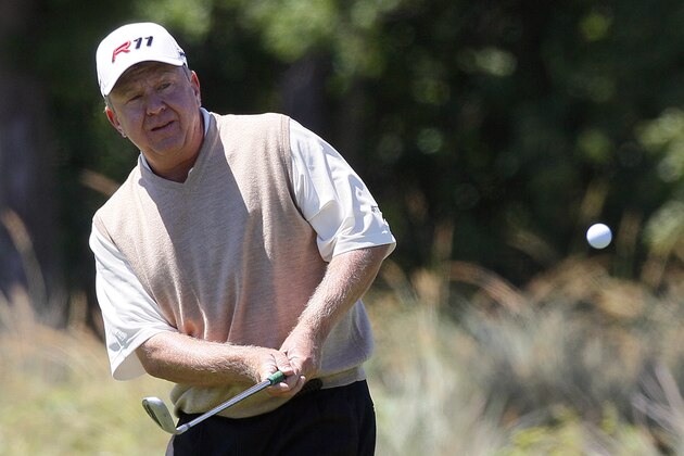 Billy Mayfair chips onto the 13th green during the first round of the Zurich Classic PGA golf tournament in Avondale, La., Thursday, April 28, 2011. (AP Photo/Patrick Semansky)