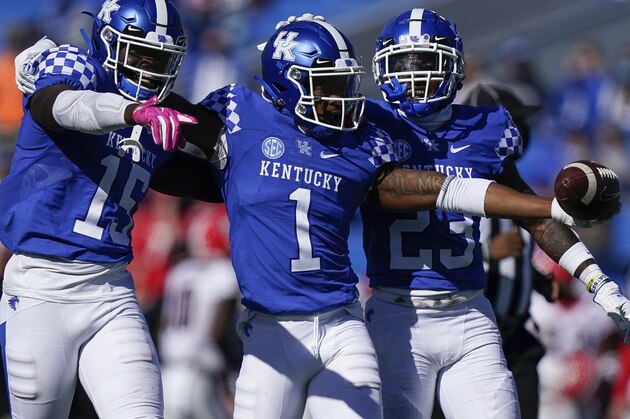 Kentucky defensive back Kelvin Joseph (1), linebacker Jordan Wright (15), and Kentucky defensive back Tyrell Ajian (23) celebrate after a play during the second half of an NCAA college football game \against Georgia, Oct. 31, 2020, in Lexington, Ky. (AP Photo/Bryan Woolston)