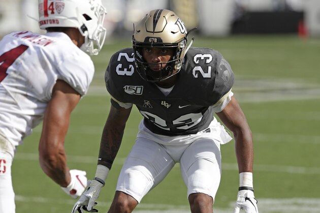Central Florida defensive back Tay Gowan (23) covers Stanford wide receiver Michael Wilson (4) during the first half of an NCAA college football game, Saturday, Sept. 14, 2019, in Orlando, Fla. (AP Photo/John Raoux)